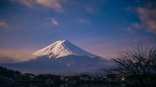 View of snowcapped mountain against cloudy sky