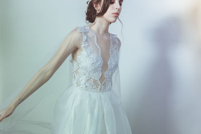 Young woman wearing white wedding dress