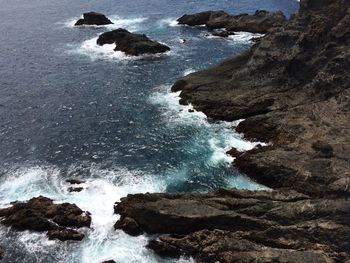 View of rock formation in sea