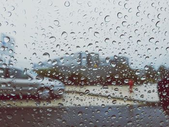 Full frame shot of wet glass window in rainy season