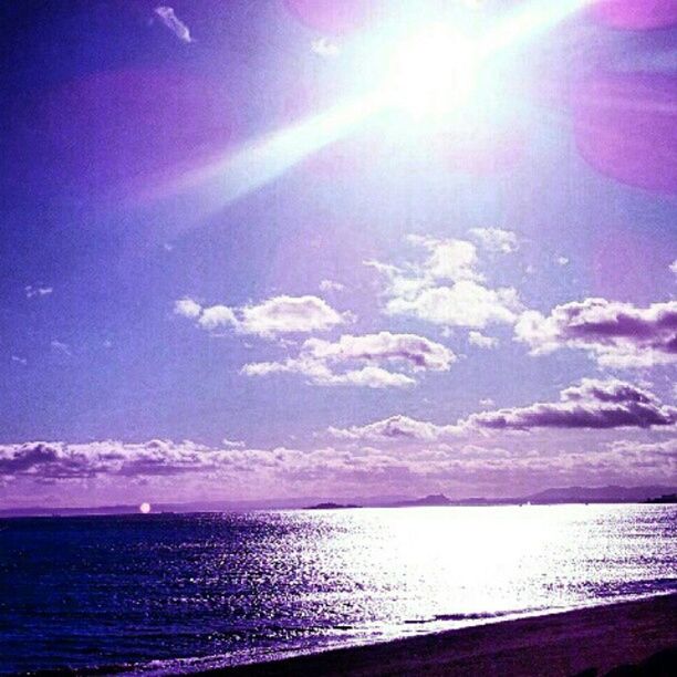 sea, horizon over water, water, sun, scenics, tranquil scene, sky, beauty in nature, sunbeam, tranquility, beach, sunlight, nature, idyllic, shore, blue, cloud - sky, lens flare, sunset, reflection