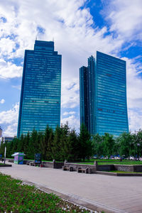 Modern buildings in city against sky
