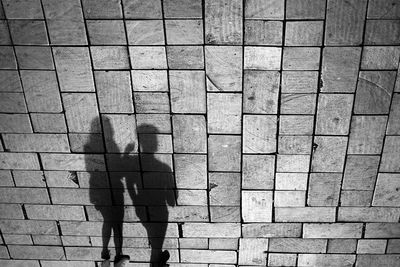 High angle view of people walking on footpath