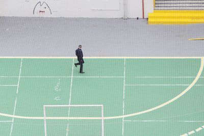 High angle view of man on sports court
