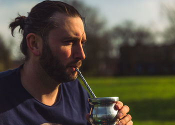 Portrait of a middle age man drinking yerba mate