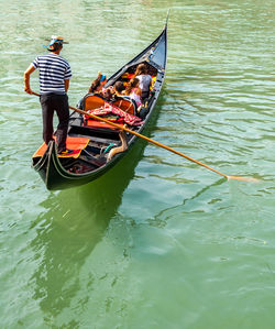 People on boat in canal