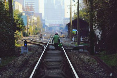 Man walking on railroad track