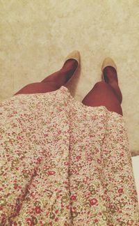 Low section of woman standing on tiled floor