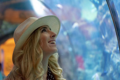 Portrait of young woman wearing hat