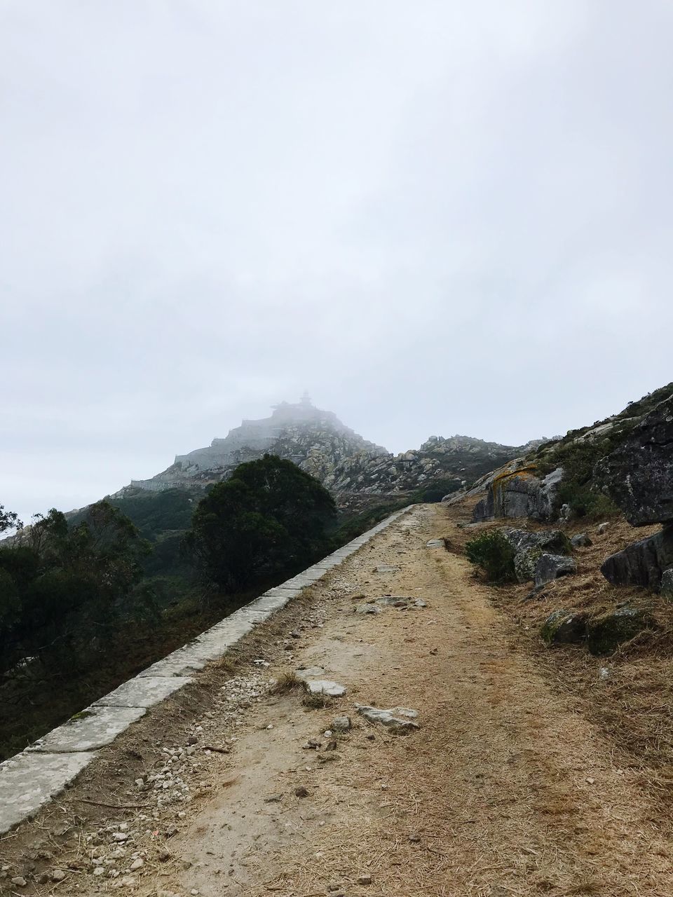 sky, mountain, road, tranquility, nature, beauty in nature, landscape, the way forward, direction, tranquil scene, day, no people, non-urban scene, scenics - nature, cloud - sky, environment, plant, transportation, outdoors, mountain peak