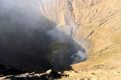 Smoke emitting from volcanic mountain