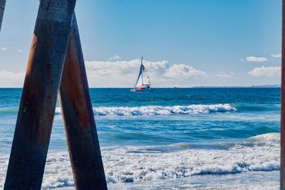 Sailboat on sea against sky