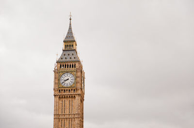 Low angle view of clock tower against sky