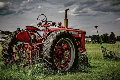 Tractor on field against sky