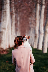 Rear view of man with dog