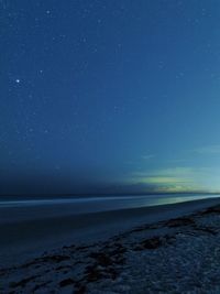 Scenic view of sea against sky at night