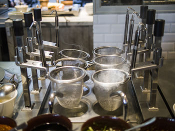 Close-up of wine glasses on table in restaurant