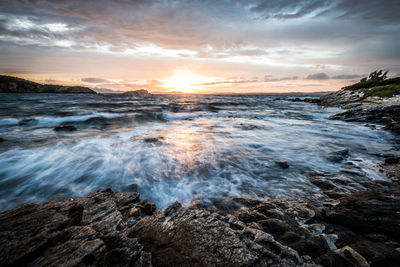 Scenic view of sea against sky during sunset