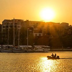 Boat in river at sunset