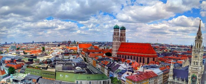 High angle view of buildings against cloudy sky