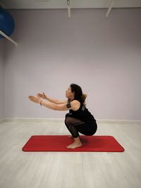 Woman exercising in home