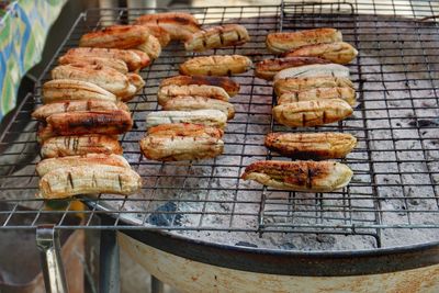 High angle view of meat on barbecue grill