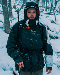 Man standing on snow covered land