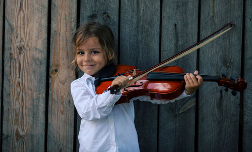 Young woman playing violin