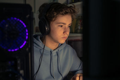 Boy using computer while sitting at home