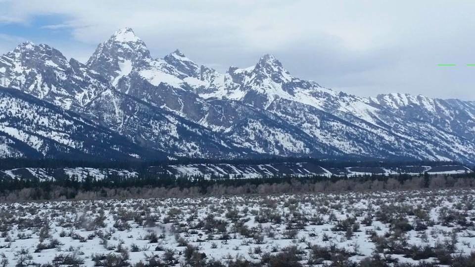 SNOW COVERED MOUNTAINS AGAINST SKY