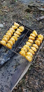 High angle view of meat on barbecue grill