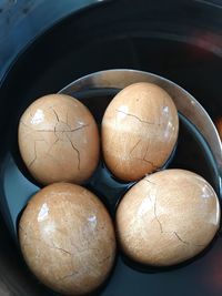 High angle view of chinese tea eggs in container on table