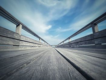 Surface level of road on bridge against sky