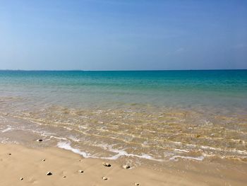 Scenic view of beach against clear sky