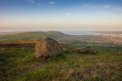 Scenic view of landscape against sky during sunset