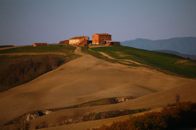 View of building on mountain against clear sky