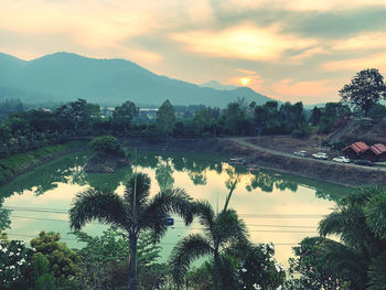 Scenic view of lake against sky during sunset