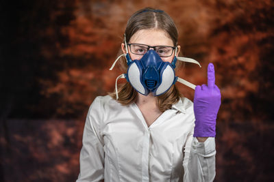Portrait of young woman wearing mask