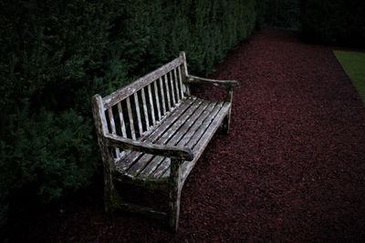 High angle view of empty bench on field