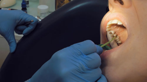 Dentist examining patient