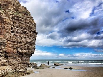 Scenic view of sea against cloudy sky