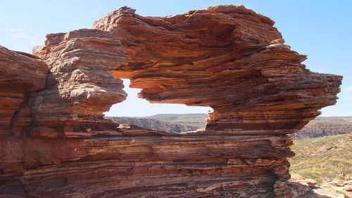 Scenic view of rock formation against sky