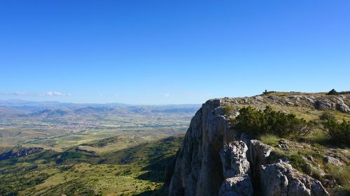 Scenic view of mountains against clear blue sky