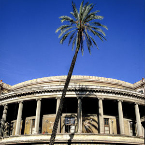 Low angle view of built structure against clear blue sky