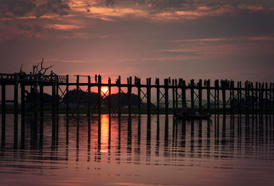 Scenic view of pier against sky during sunset