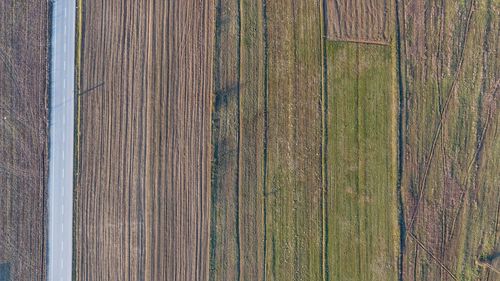 Aerial view of road amidst field