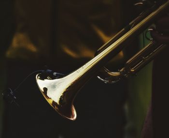 Close-up of person playing a trumpet