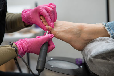 Cropped hand of doctor giving medicine