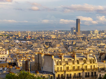 Cityscape of paris with cloudy sky from montmartre, paris, france