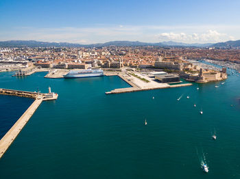 High angle view of marina by sea against sky